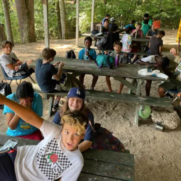 kids at picnic tables at summer camp